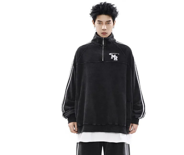 Black retro style men's stand collar hoodie jacket on a grey background.