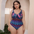 Women's blue printed one-piece swimsuit with spaghetti straps and a striped vest design