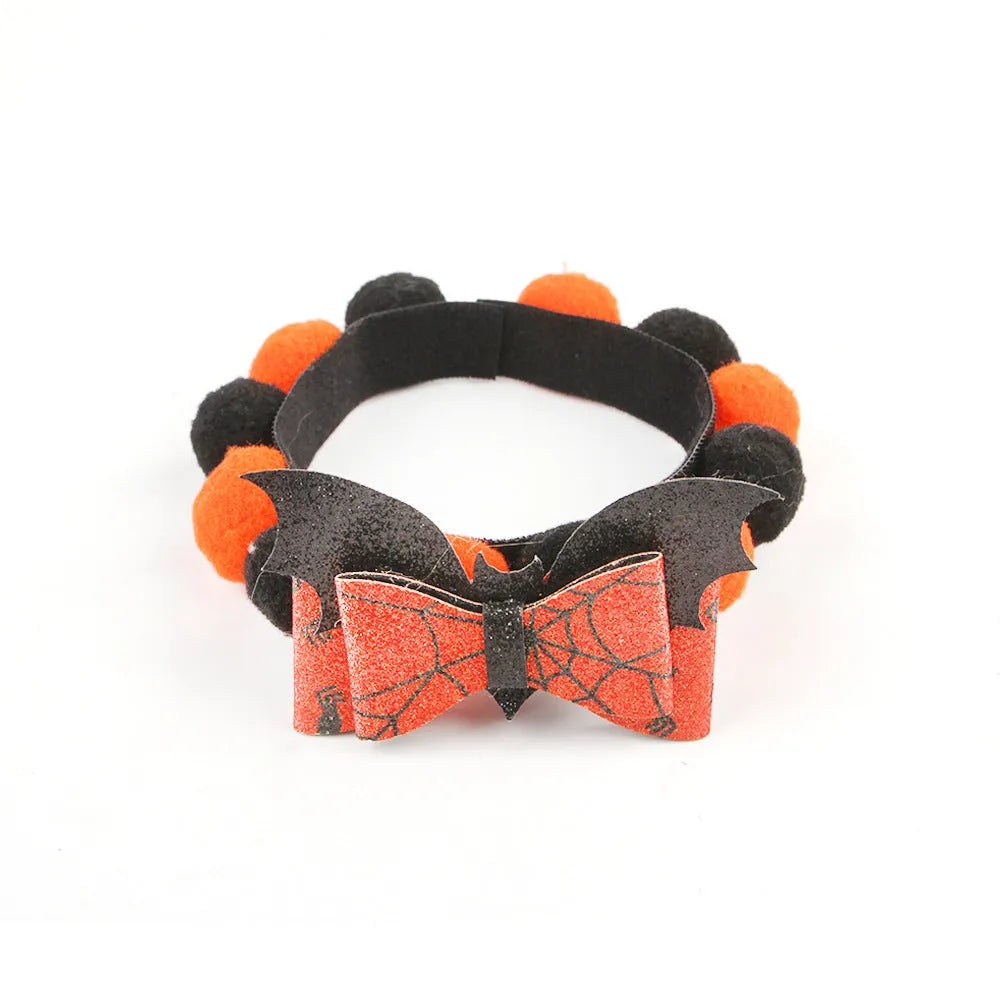 Halloween pet collar with fluffy fur ball accessory in pumpkin design, shown in size M