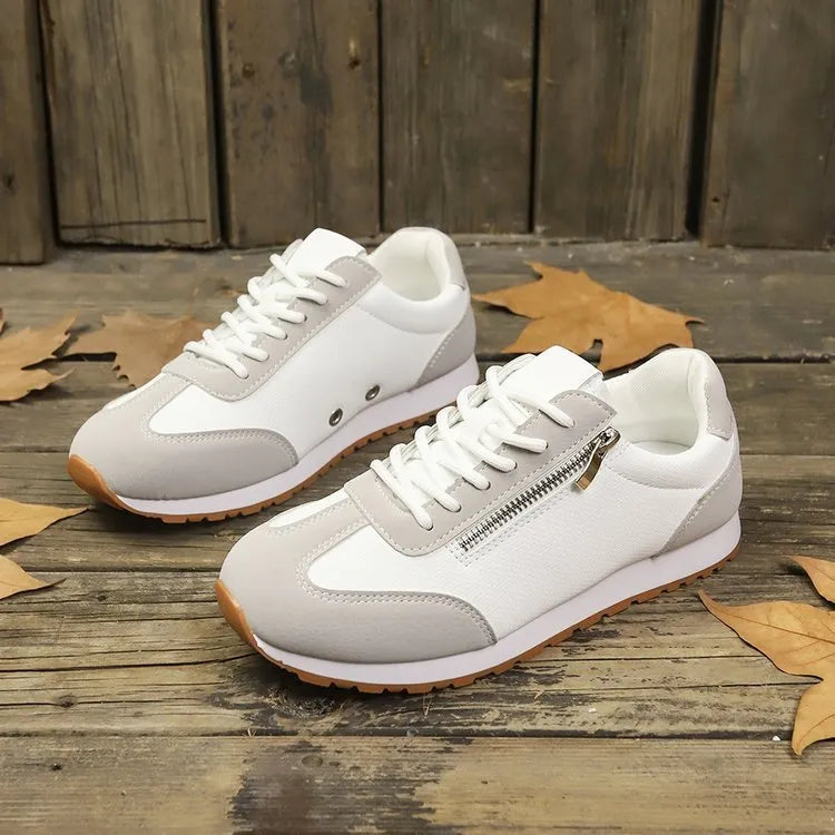 Women's flat-heeled shoes in champagne, grey, and white colours showing lightweight artificial PU uppers and rubber soles
