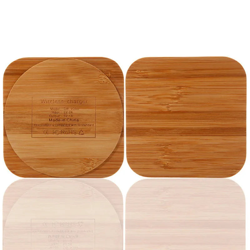 Square brown heart-shaped wooden bamboo 5W wireless charging pad on a table.
