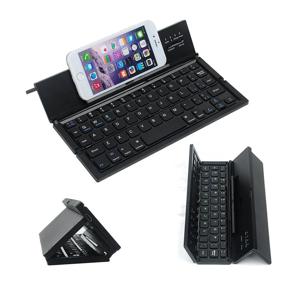 Black folding Bluetooth wireless keyboard next to tablet showing compact portable design