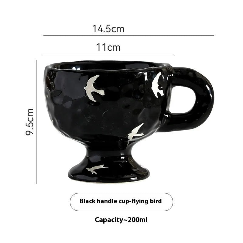 Hand-pinched irregular shaped ceramic mug in a solid colour, shown from the side.