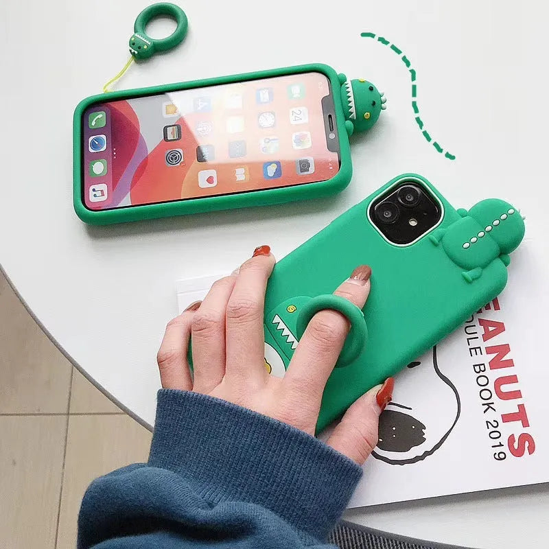 Green silicone iPhone case with cartoon animal design showing drop protection features