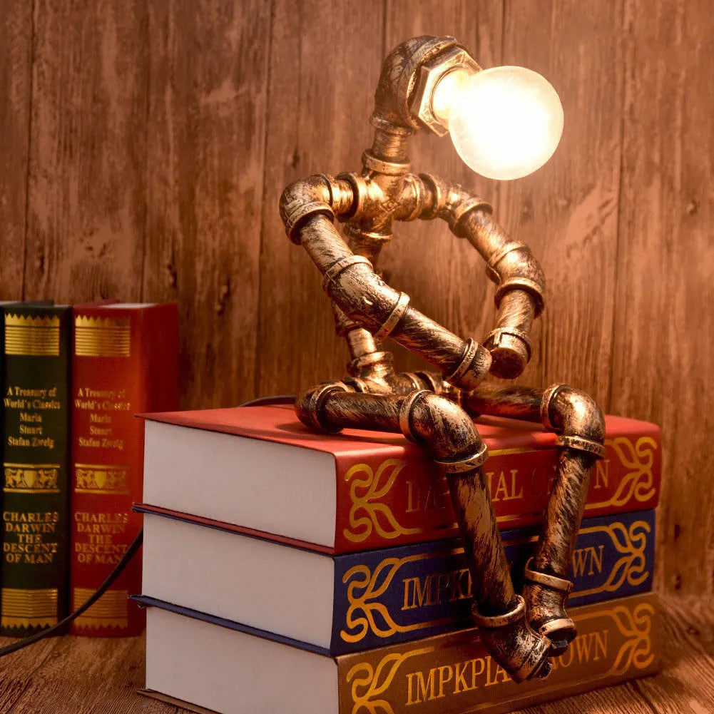 Vintage industrial robot table lamp with iron pipe design and water pipe light filtering