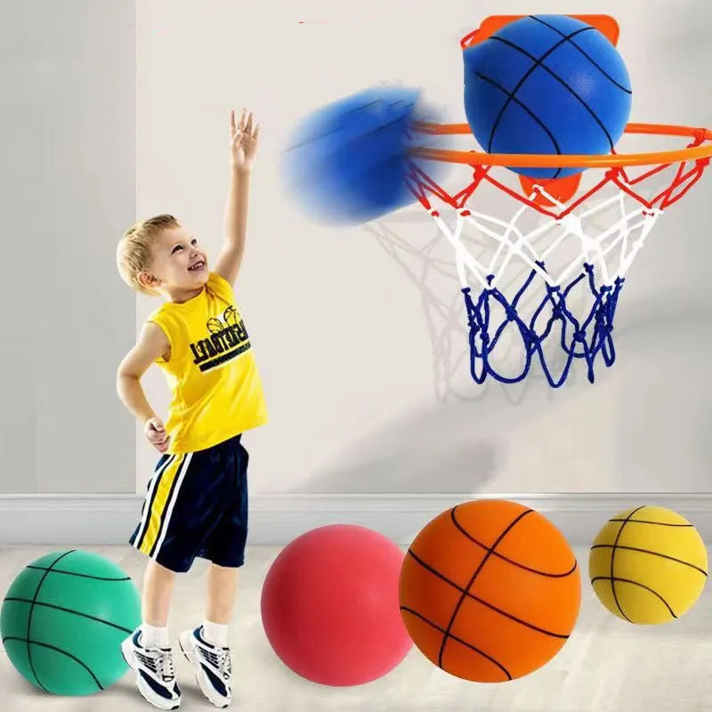 Silent high density foam sports ball in assorted bright colours next to a basketball frame.