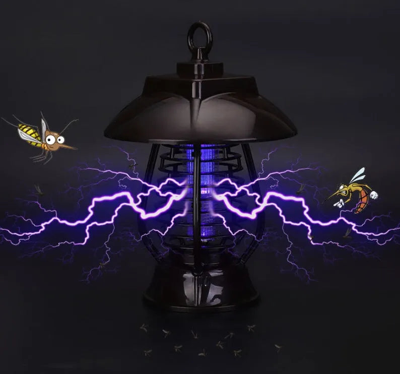 White outdoor solar mosquito lamp with purple switch and solar panel on top for garden insect control.
