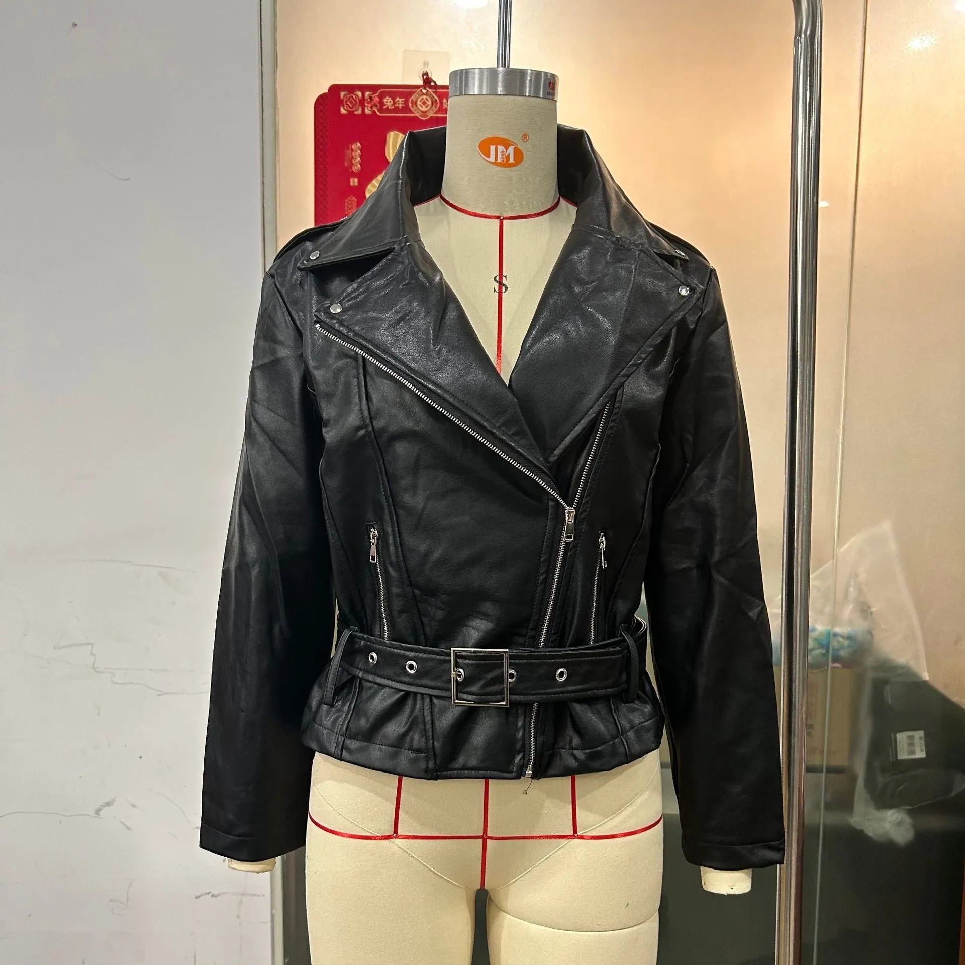 Black punk locomotive style jacket with short belt lapel and Peter Pan collar