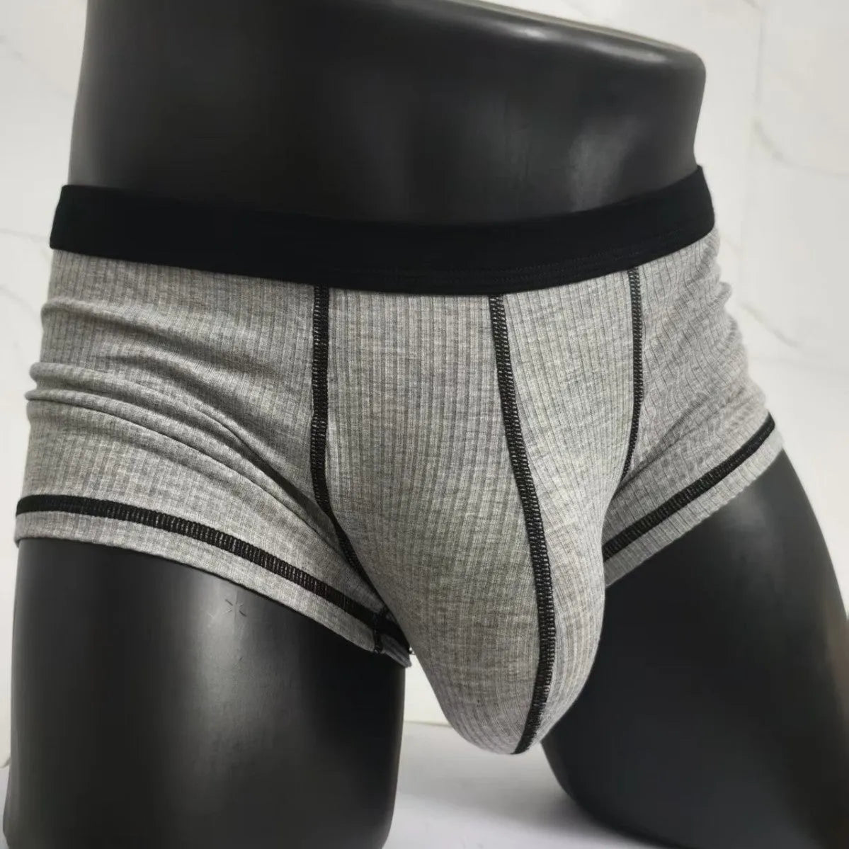 Men's breathable boxers in Army Green solid colour showing thin fabric construction and body shaping design