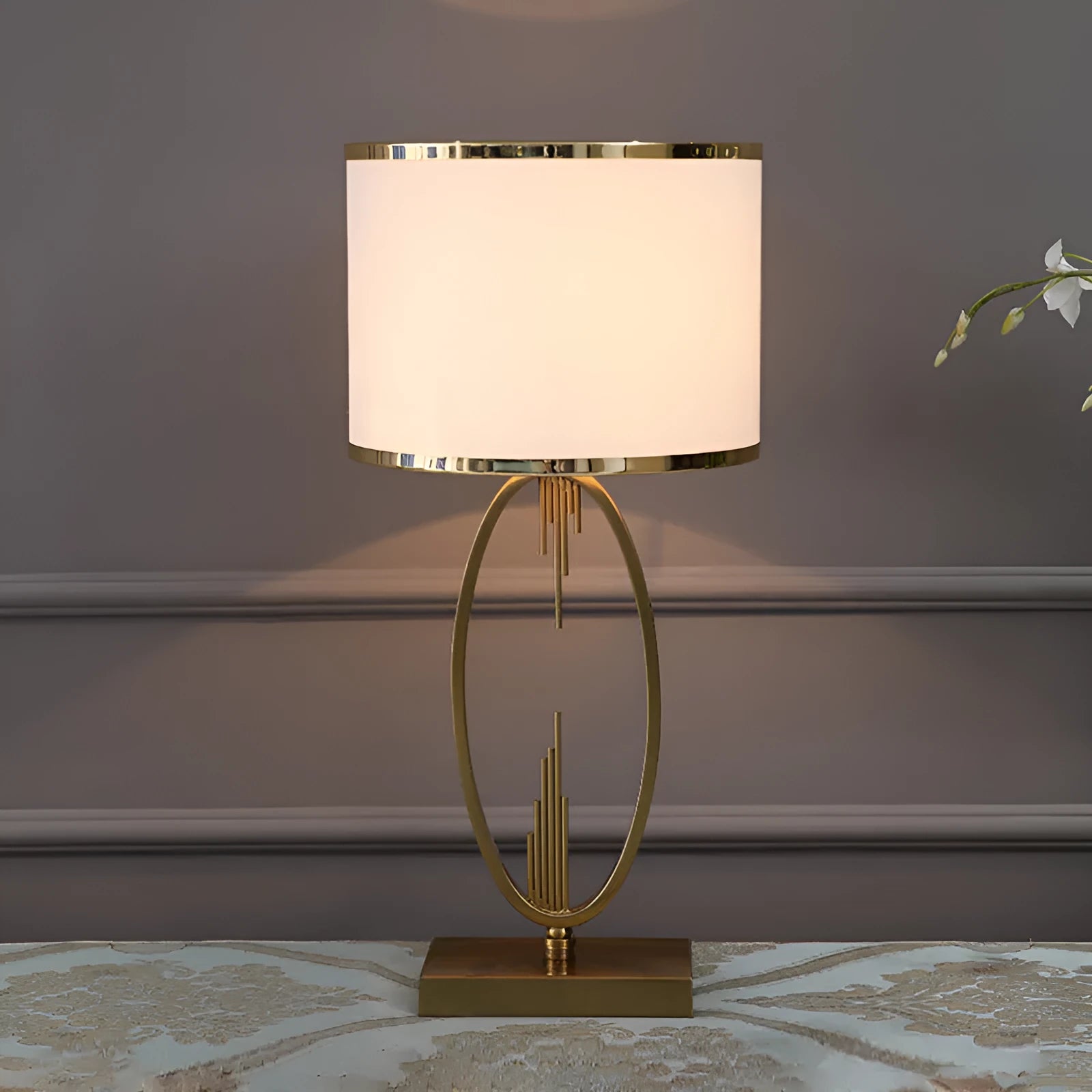 White Nordic style bedside lamp with drum shape and Phnom Penh trumpet design on a wooden table