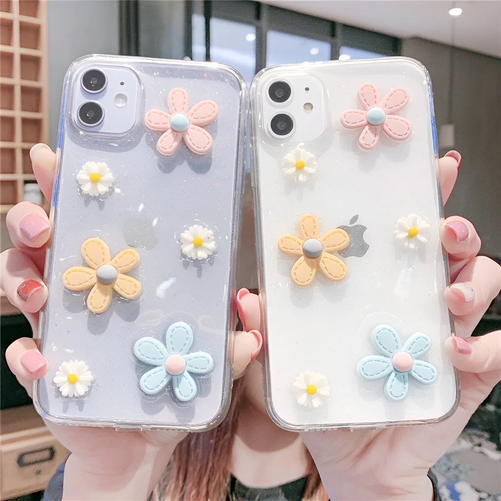 Soft rubber iPhone case with embossed floral pattern and heart design on a white background.
