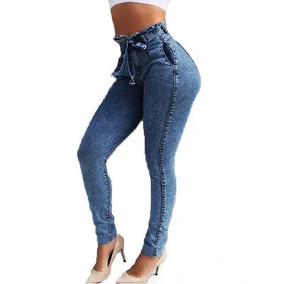 Pair of women's light blue straight-leg jeans with a frayed, distressed hem detail.