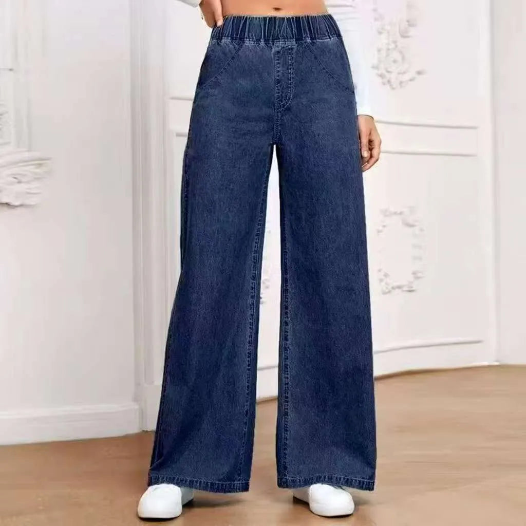 Plus size light blue washed denim jeans with wide leg straight cut and zip fly