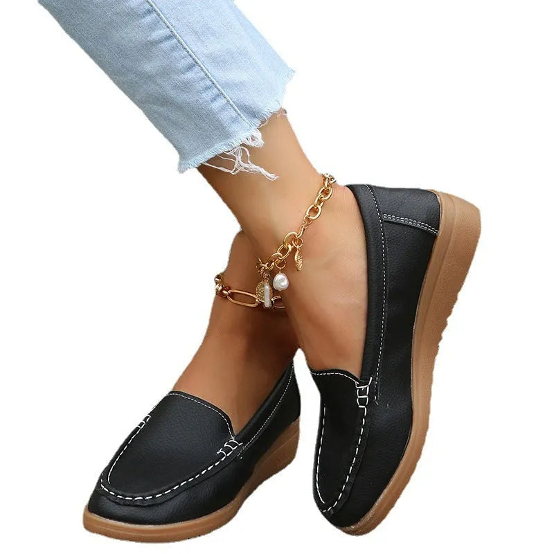 Women's flat slip-on loafers in PU leather, showing round toe and available colour options