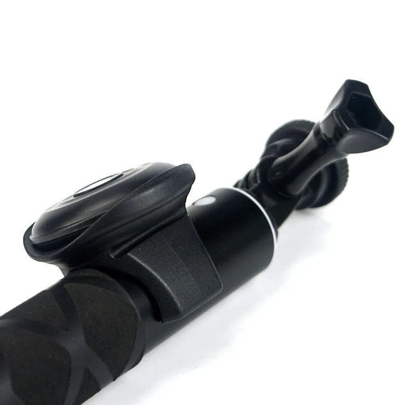Black Bluetooth remote control for wireless smartphone camera photos and videos.