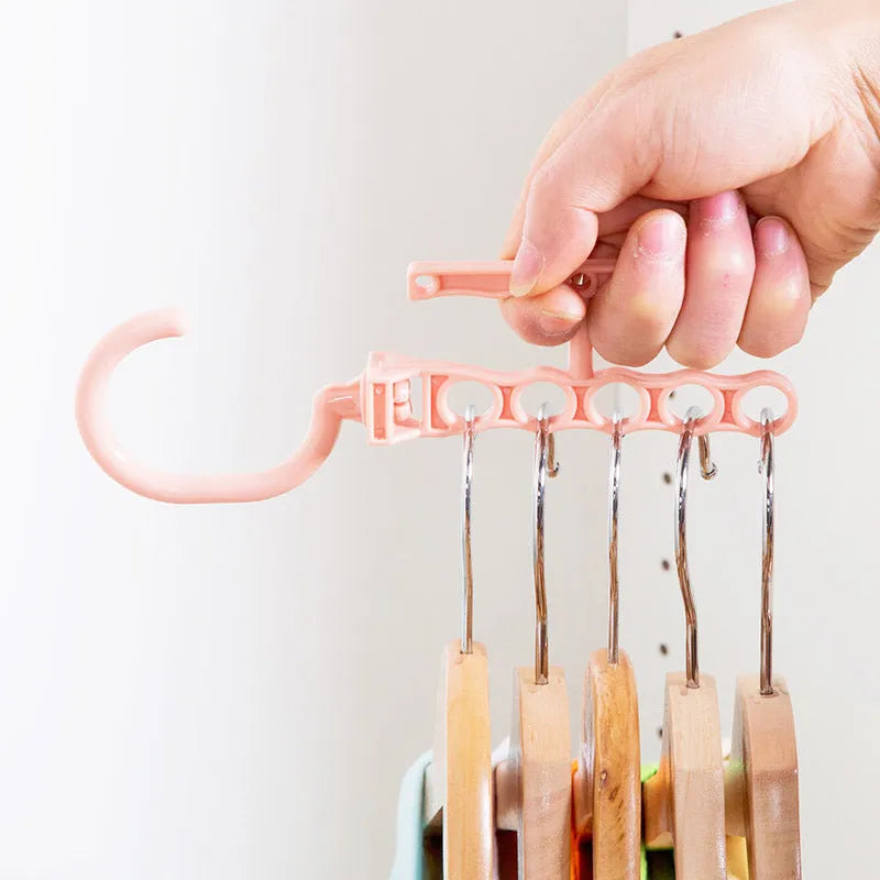 Blue rotating wardrobe hanger with five hooks and handle for organising multiple clothing items