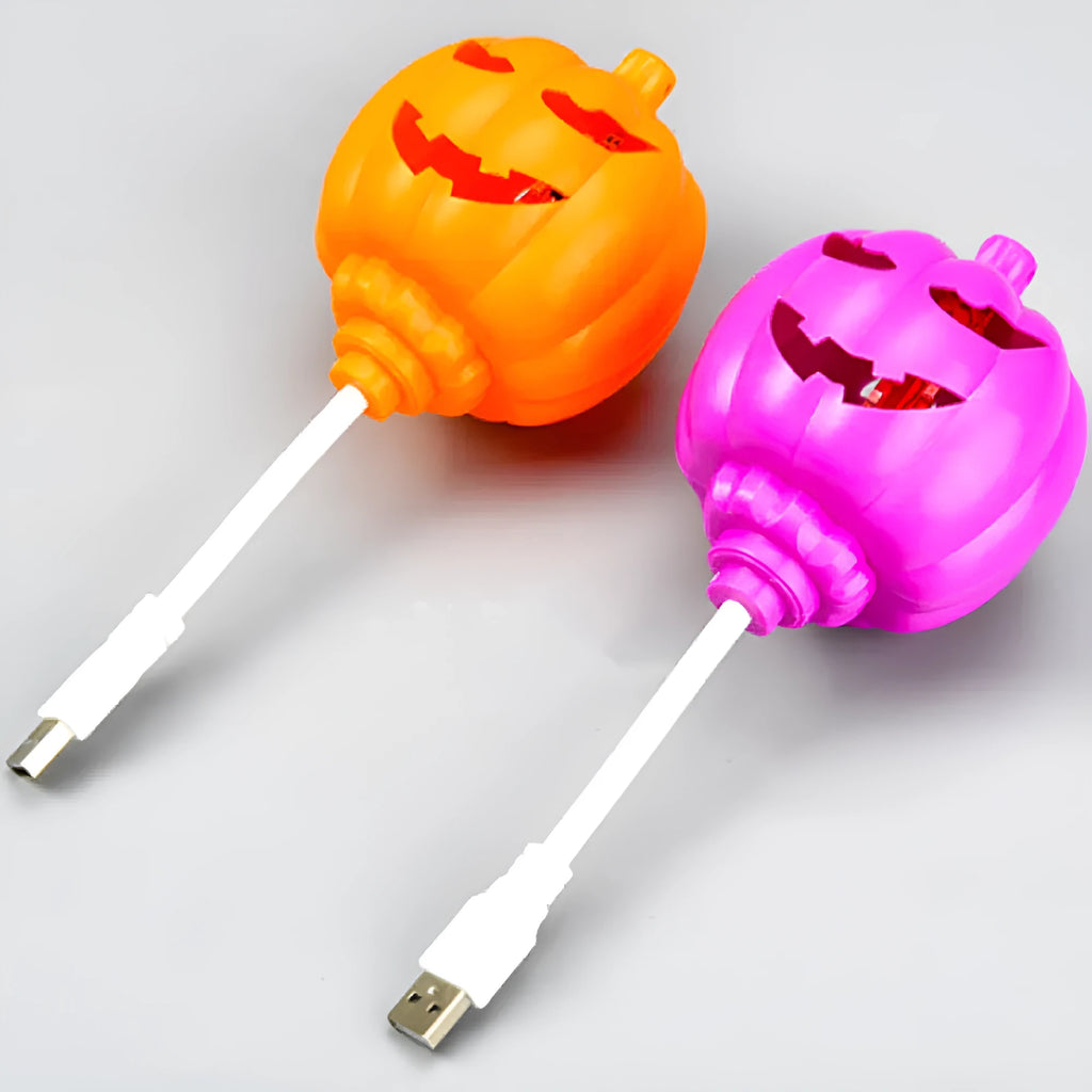 Plastic pumpkin-shaped lamp with USB charging cable, showing purple light option.