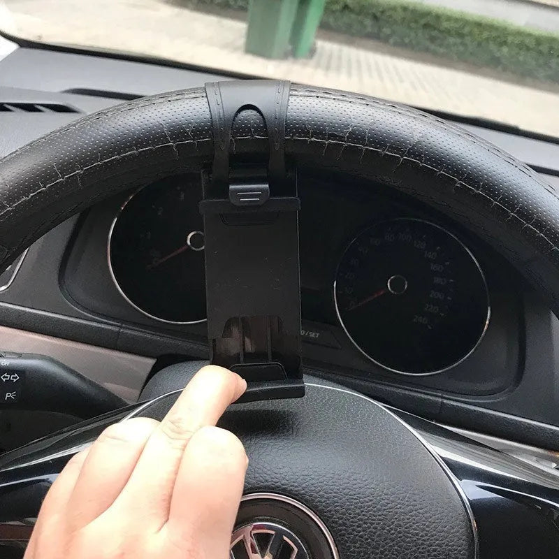 Black steering wheel phone clip mount holding smartphone for car navigation