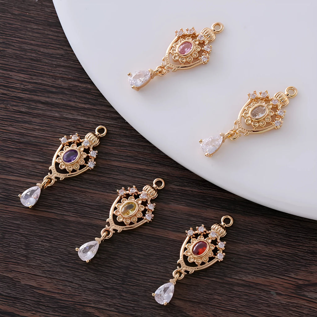 Hollow water drop shaped pendant with micro inlaid zircon on a crown outline in five colour options.