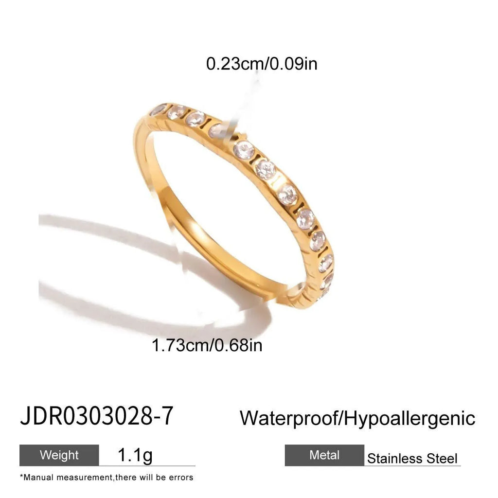 Geometric titanium steel zircon ring in a European American style on a plain background.