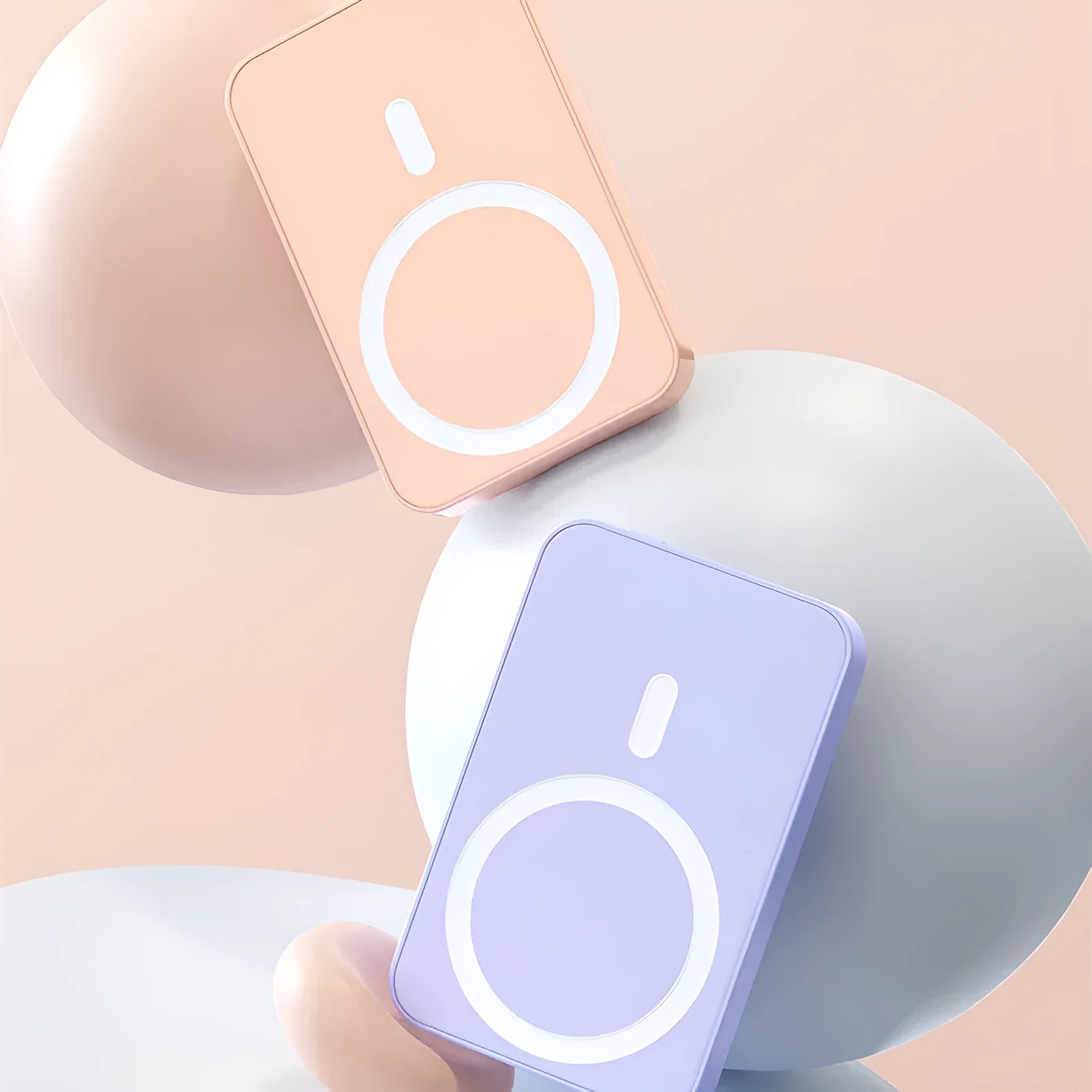 Mobile wireless magnetic power bank with plastic housing showing colour options pink purple white