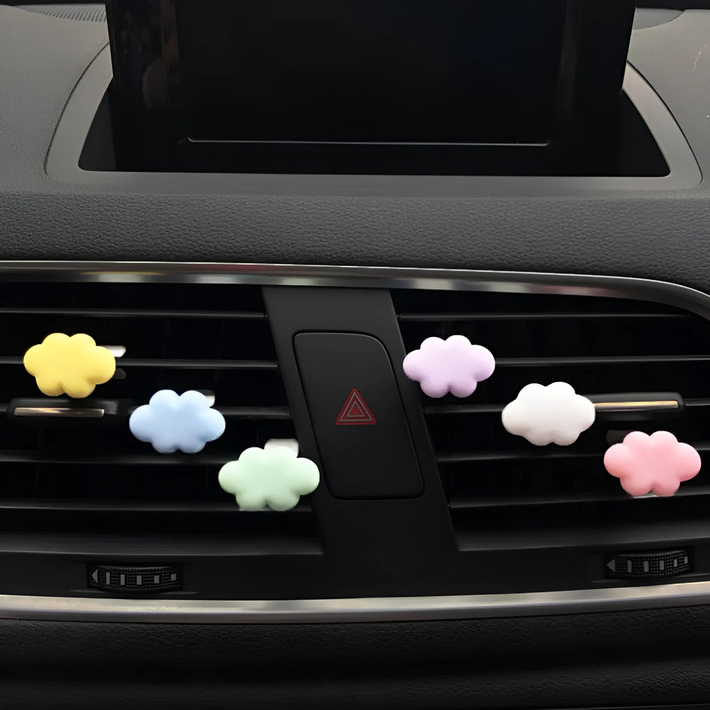 Baiyun cartoon car fragrance clip in resin, shown in various colours for air vent mounting.