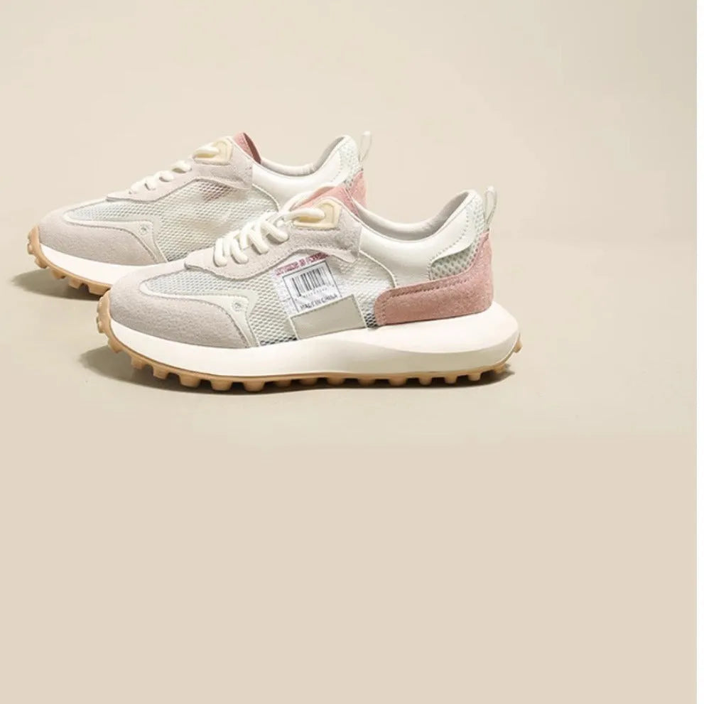 Women's grey retro sneaker with low-top design, mesh lining, and rubber sole