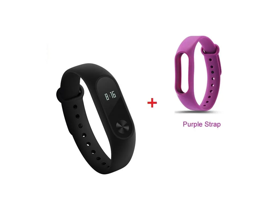 Xiaomi Mi Band 2 black smartband on wrist showing OLED display with heart rate and step count.
