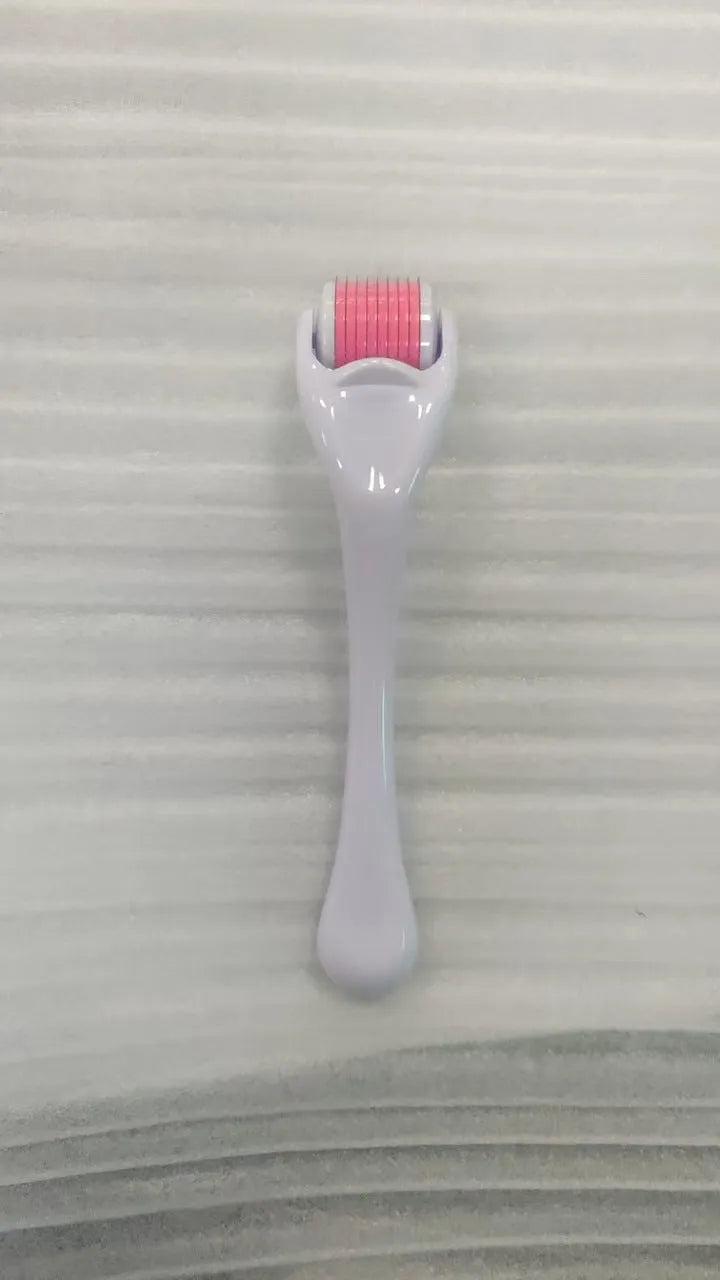 Black handle micro needle roller with purple wheel showing 540 stainless steel needles for dermaplaning