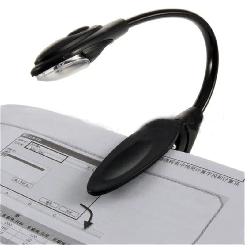 Mini clip-on LED book light in black with 26cm flexible neck and metal clip for attaching to a book