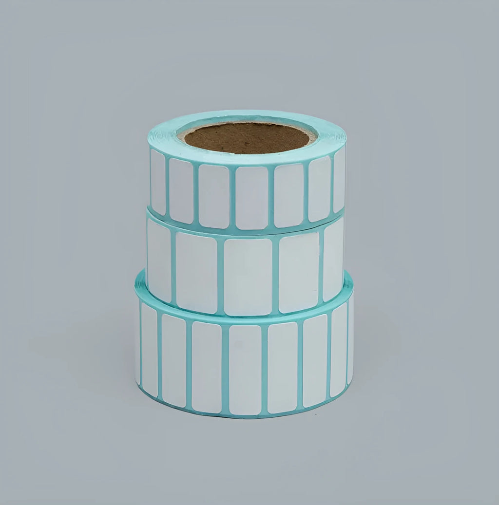 Roll of waterproof black and blue sticky sticker labels 20mm x 10mm 3000 sheets double row horizontal layout on table