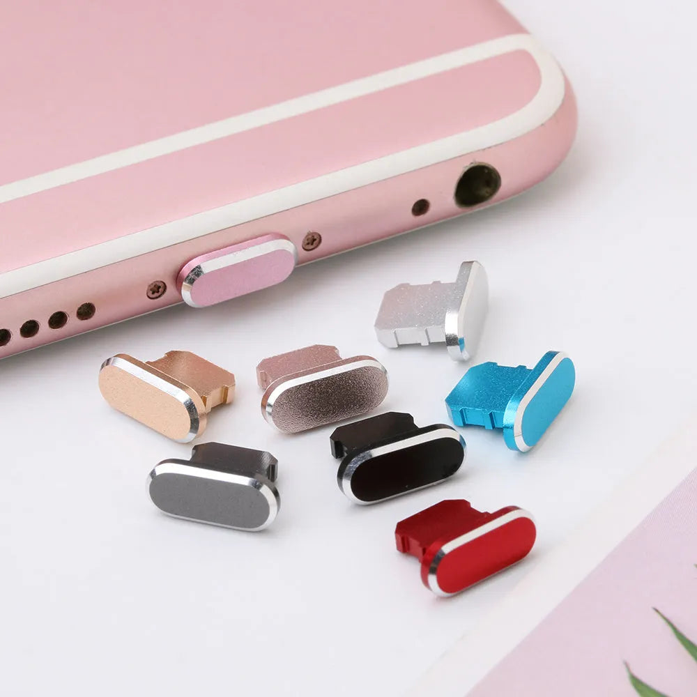 Aluminium alloy mobile phone charging port dust plug for iPhones, shown in rose gold colour.