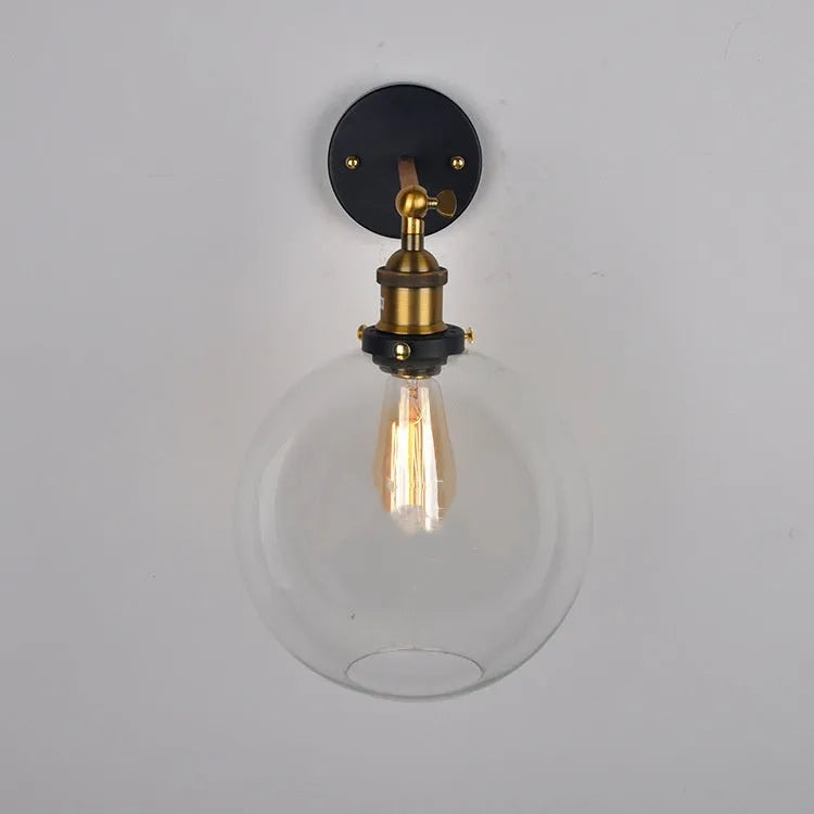 Retro round glass ball wall lamp in amber finish with 20cm diameter and aluminium holder.