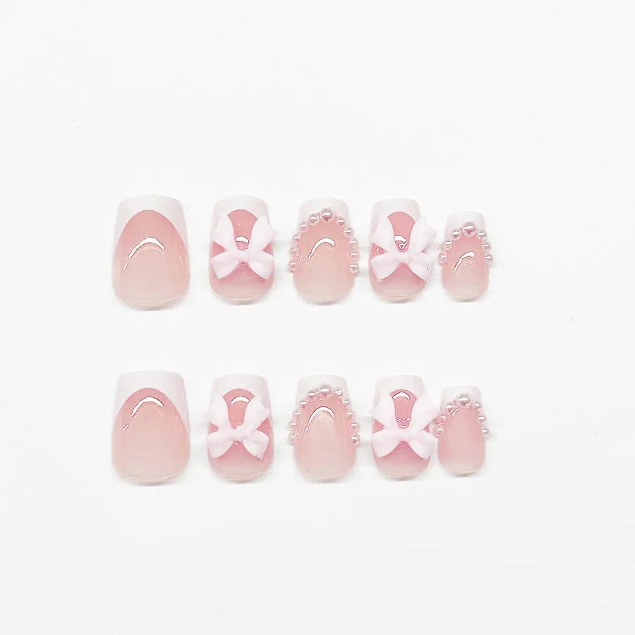 French manicure nail art set showing short white design with tulip, bow, starry sky, leopard print, and XINGX patterns