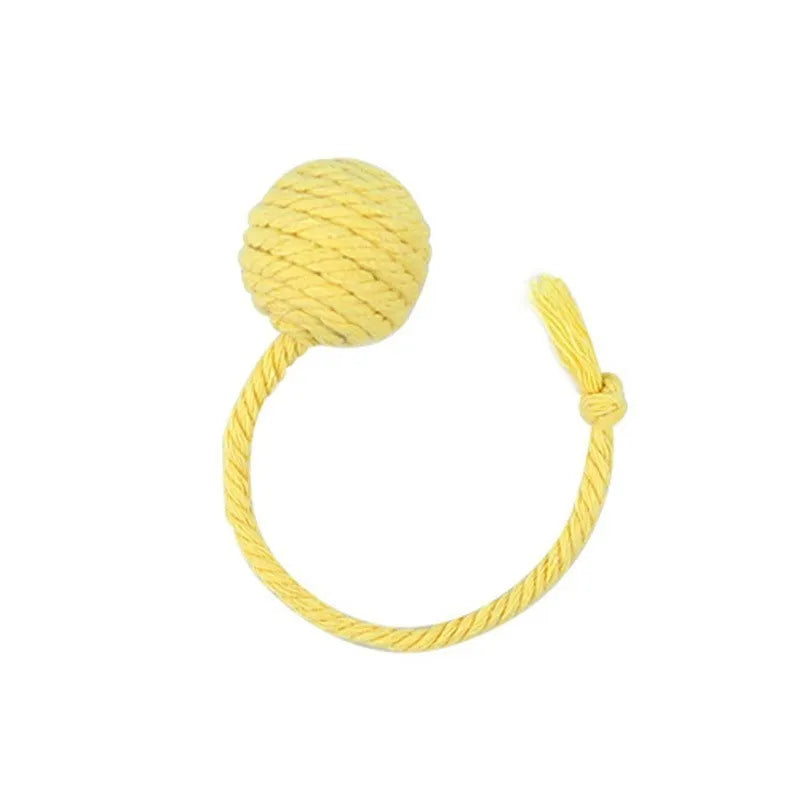 Green and pink soft plush cat toy balls with rope tails and internal bells
