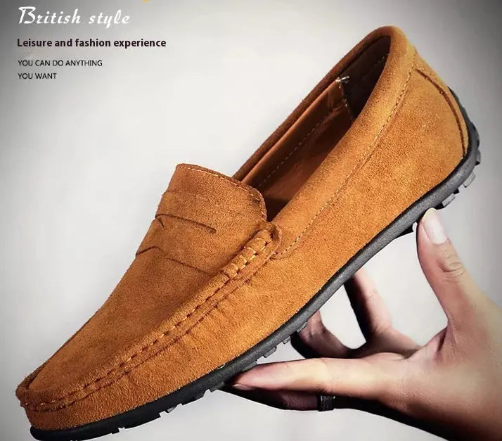 Men's brown suede casual loafers with a round toe and flat rubber sole on a white background.