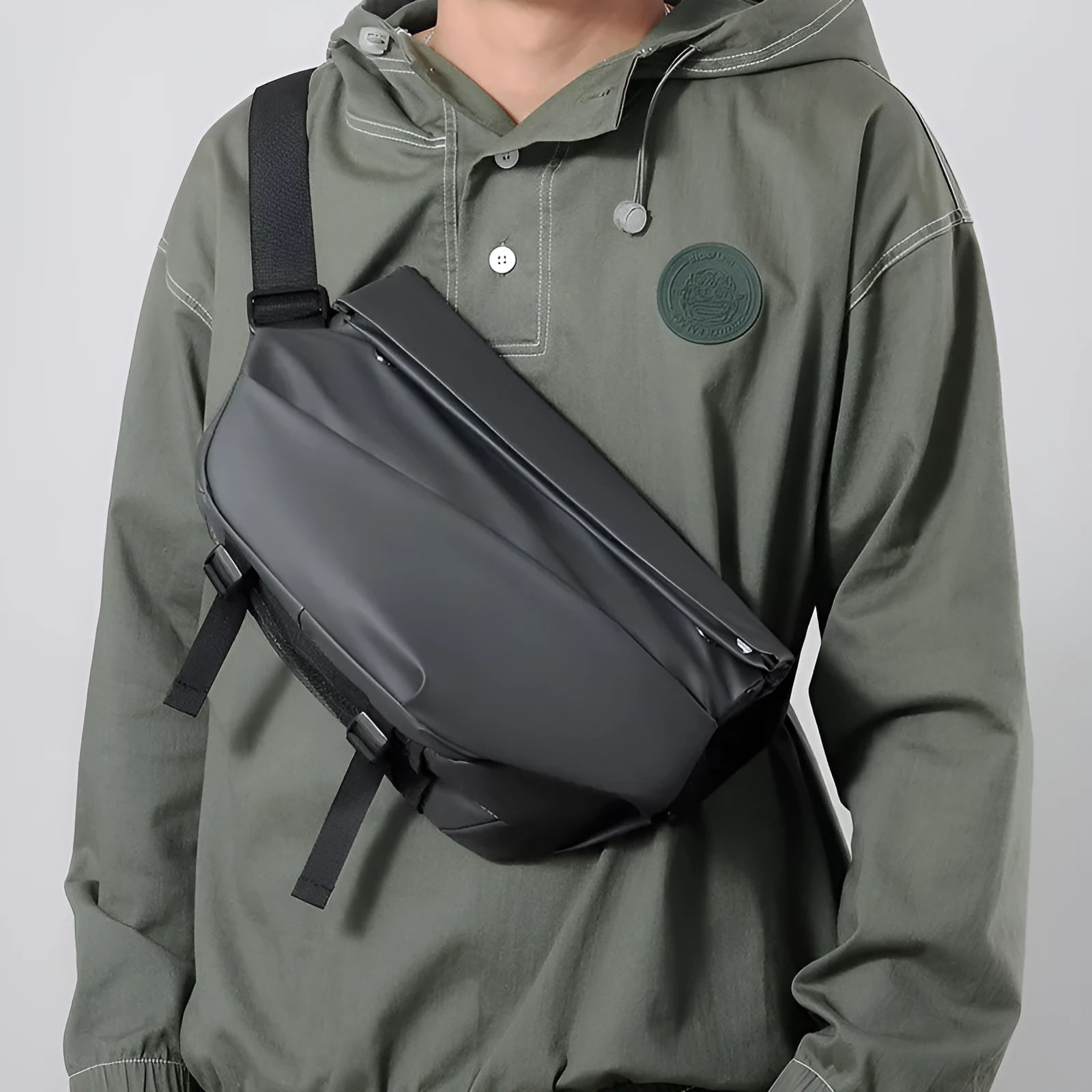 Grey PU crossbody bag with single adjustable shoulder strap showing interior phone pocket