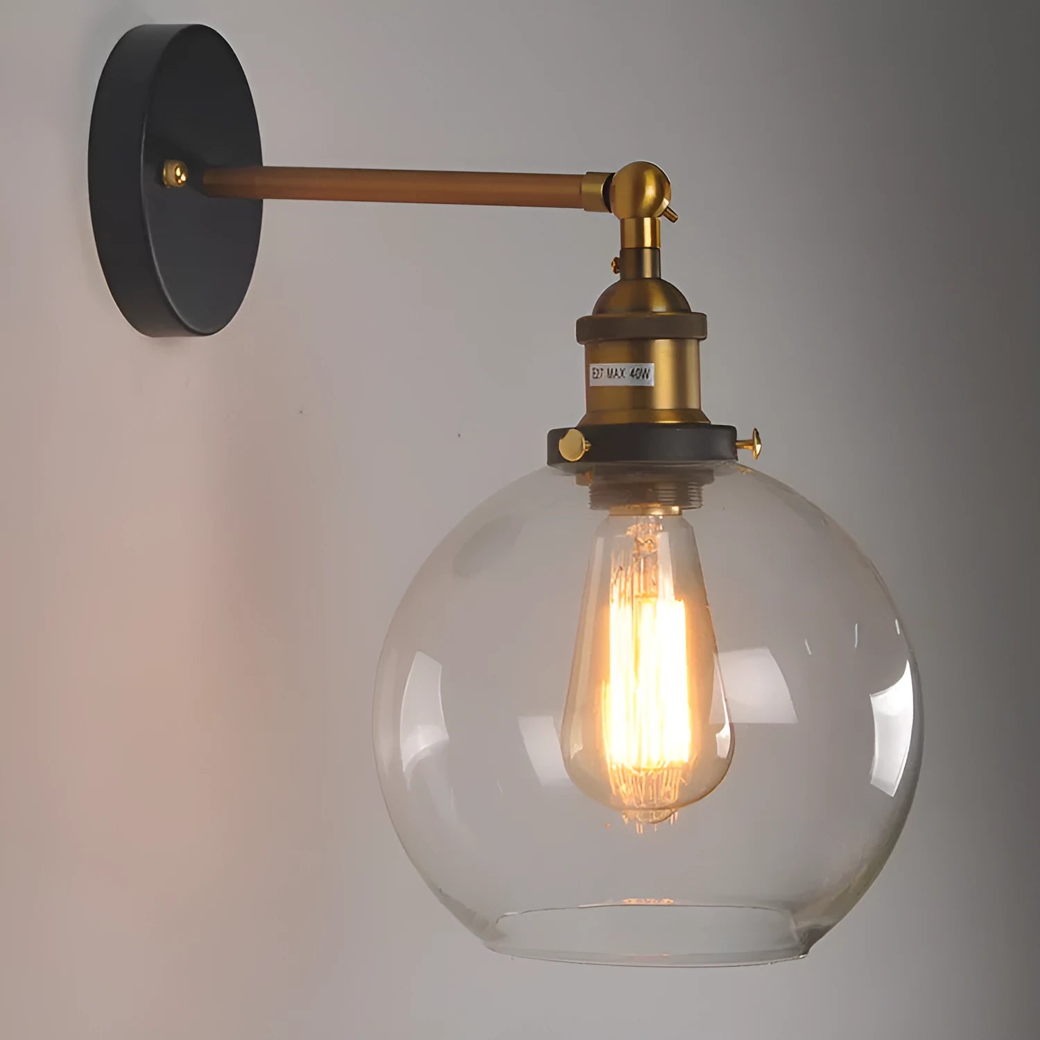 Retro round glass ball wall lamp in amber finish with 20cm diameter and aluminium holder.