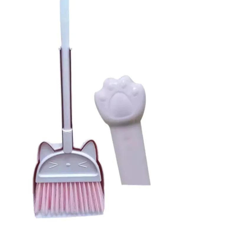 Purple plastic broom and dustpan set with non-stick rotating brush head and upright storage holder.