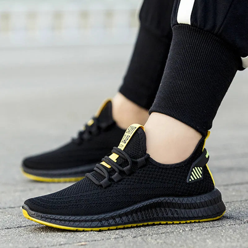 Men's fly woven casual sneakers in orange with flat heel and round toe design