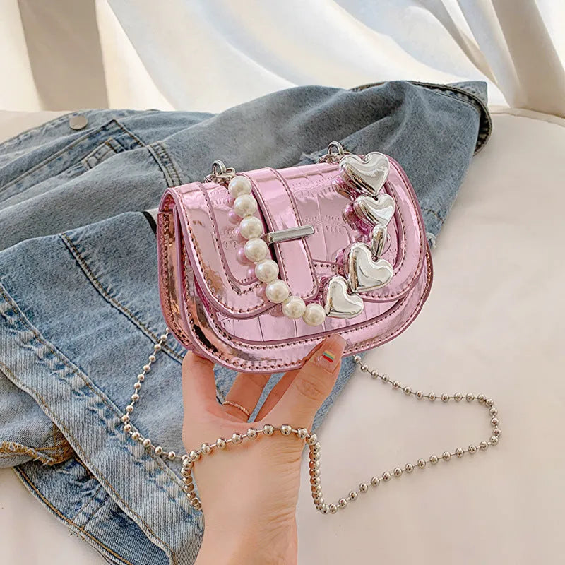 Laser pearl effect mini saddle tote handbag in horizontal square shape with crossbody strap