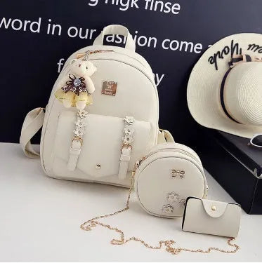 Women's floral pu leather three-piece bag set showing backpack, shoulder bag, and card purse.