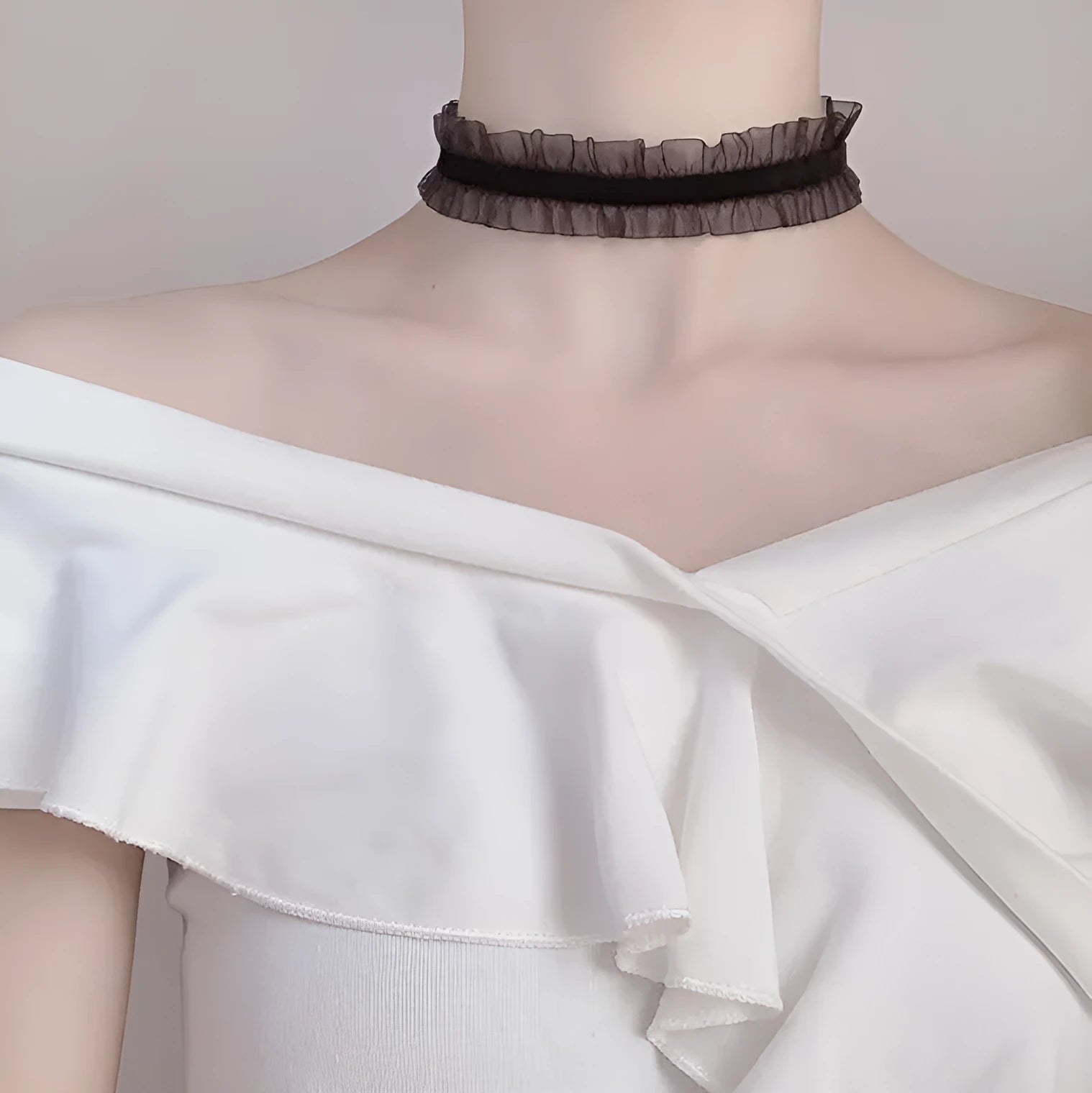 Close-up of an alloy floral pendant necklace with a velvet ruffle texture on an adjustable snake bones chain.