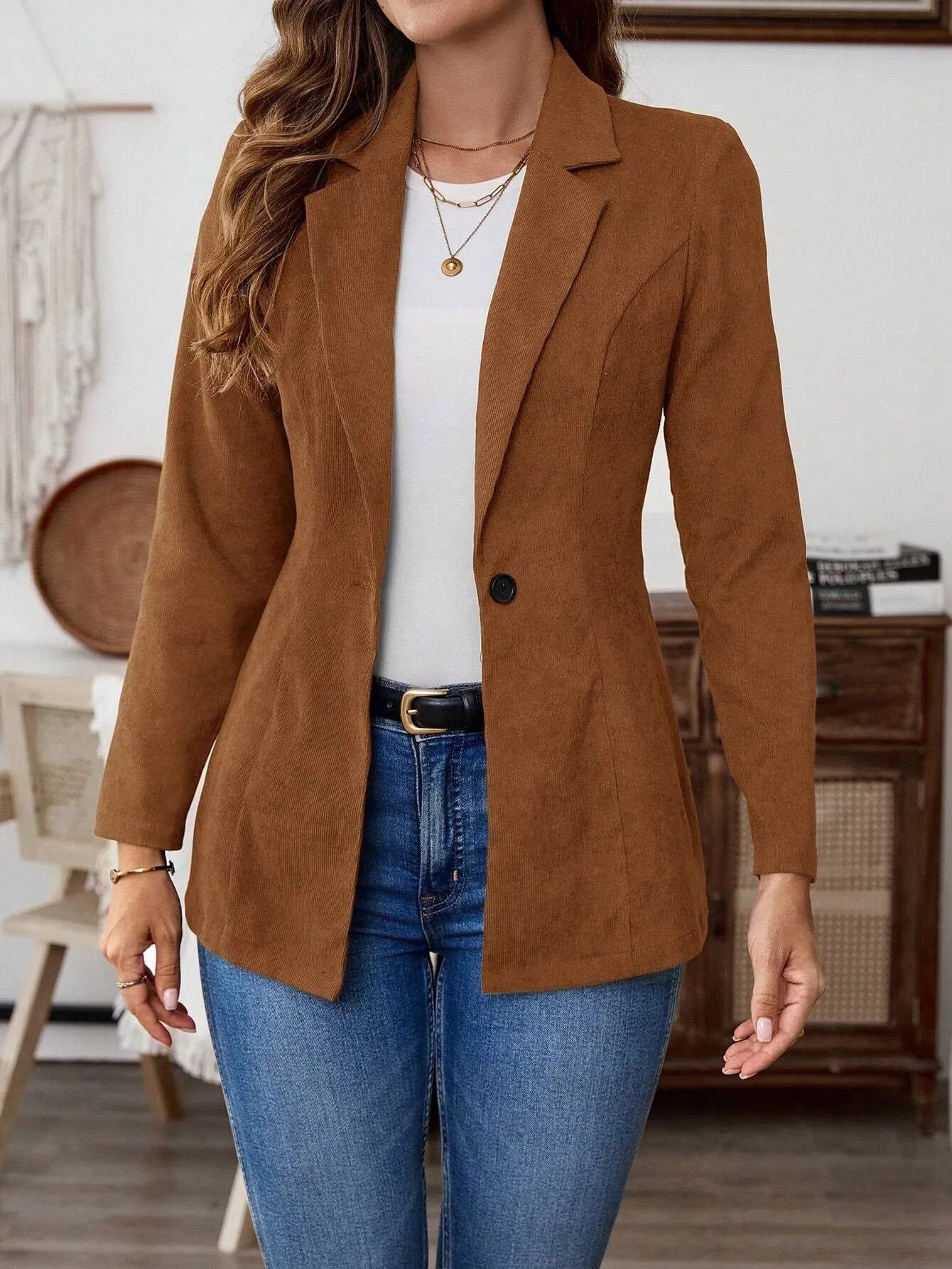 Brown single-breasted suit coat with lapel collar and long sleeves
