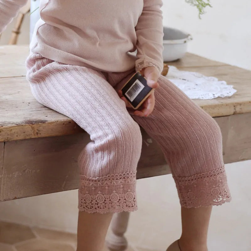 Girls loose knitted lace trim straight-leg trousers in pink, apricot, and white colours