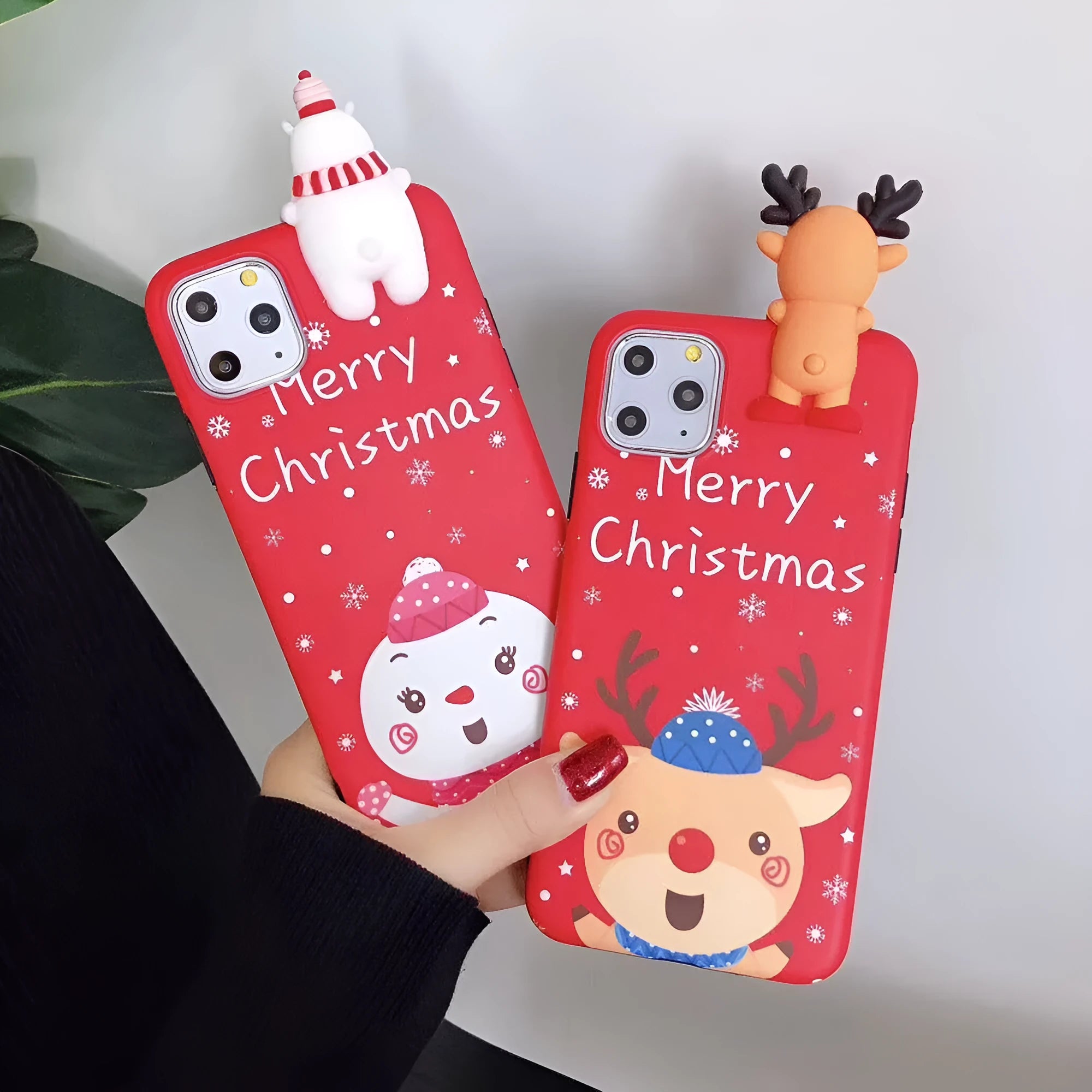 Christmas-themed silicone back cover case for iPhone on a red background.