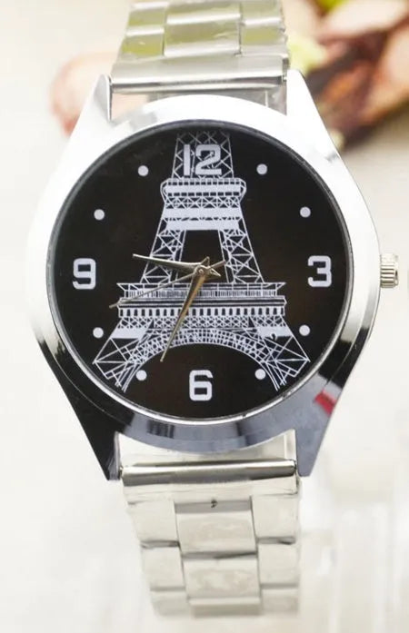 Blue dial Eiffel Tower wristwatch with leather strap on stainless steel buckle.