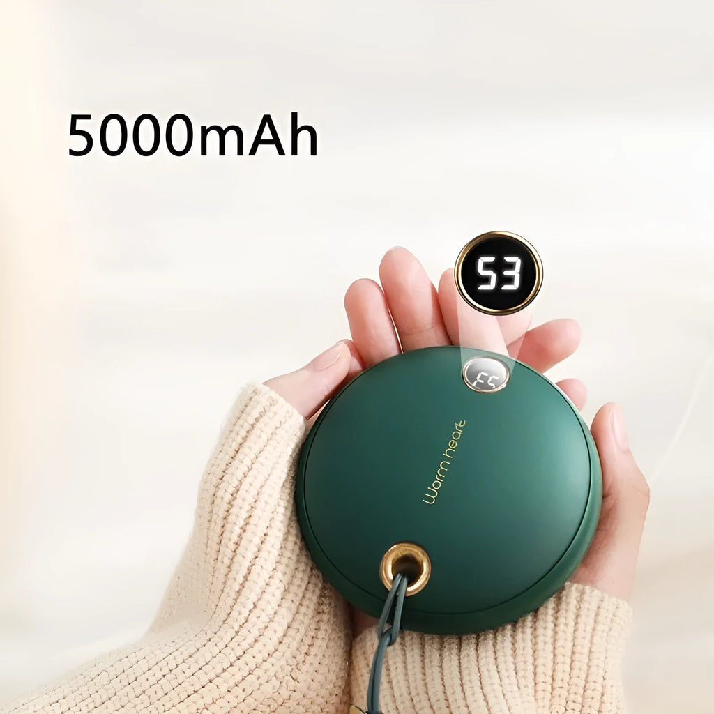 Green hand warmer power bank with digital display showing battery percentage, next to charging cable