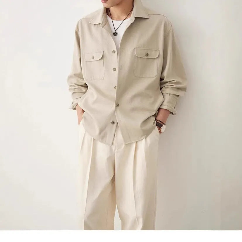 Men's light sand rice coloured long sleeve shirt with a lapel collar, laid flat to show front design.