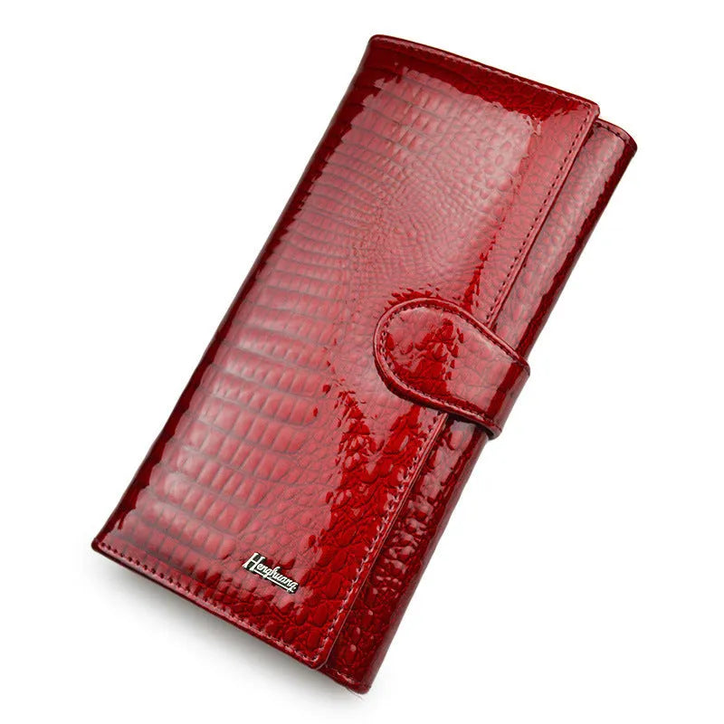 Women's patent leather coin purse with crocodile pattern design in wine red colour